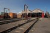 This photograph was taken at Didcot Railway Center in Oxfordshire, UK.  The building in the background is the main Engine shed with the water pump in front.  Si