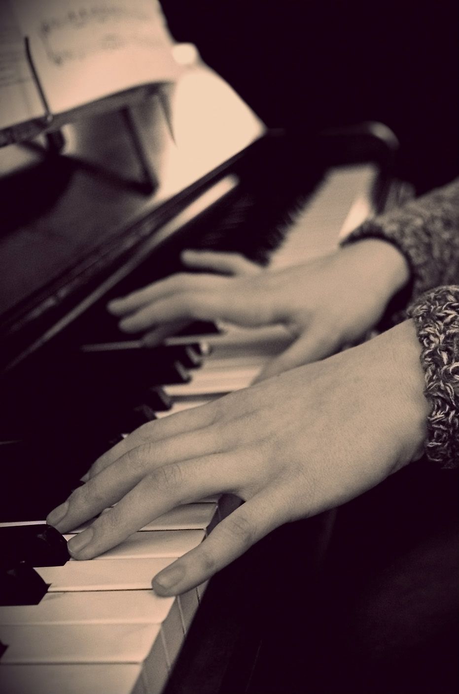 Teenage Girl playing piano.